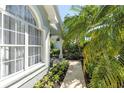 Inviting walkway lined with lush landscaping, leading to the home's entrance and creating curb appeal at 12723 Rockrose Gln, Lakewood Ranch, FL 34202