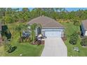 Beautiful home featuring a well-kept lawn, landscaping, and a neutral color scheme, creating a welcoming curb appeal at 13804 Camden Crest Ter, Lakewood Ranch, FL 34211