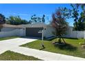 Beautiful single-Gathering home featuring an attached garage and well-maintained front yard at 1426 19Th St, Sarasota, FL 34234