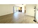 Living room with modern flooring and sliding glass doors to a balcony at 2632 Hidden Lake N Dr # E, Sarasota, FL 34237
