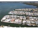 An aerial view of a waterfront community with homes, private docks, and boat access to the bay at 3708 Plumosa Ter, Bradenton, FL 34210