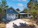 Charming home featuring a well-maintained exterior, driveway and inviting front porch at 402 71St St, Holmes Beach, FL 34217