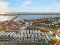 Expansive aerial view of waterfront property with a bridge, and multiple homes with docks at 4305 Marina View Way, Cortez, FL 34215