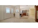 Bright foyer with tile flooring, a leaded glass front door and views to the dining room at 4420 Oak View Dr, Sarasota, FL 34232
