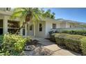 Inviting front entrance with a lush landscaped walkway and stone accents at 4420 Oak View Dr, Sarasota, FL 34232