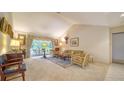 Comfortable living room with high ceilings, neutral decor, and large windows with views at 4420 Oak View Dr, Sarasota, FL 34232