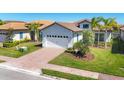 Charming one-story home with a brick driveway, two car garage, and well-manicured landscaping at 510 16Th E Ave, Palmetto, FL 34221