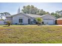 Single Gathering home boasting a well-manicured lawn and a welcoming facade at 5330 Alseir Rd, North Port, FL 34288