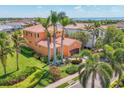 Aerial view showcasing a well-maintained property, complete with lush landscaping and a spacious two-car garage at 6211 Legends Blvd, Bradenton, FL 34210
