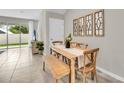 Cozy dining area with wooden table and natural light at 11814 Davis Dr, Largo, FL 33774