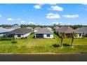 A beautiful backyard view of several houses situated on the water at 14147 Campfire Ct, Parrish, FL 34219