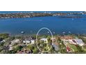 Aerial view of a waterfront neighborhood with grand homes and expansive water views at 1440 Kimlira Ln, Sarasota, FL 34231
