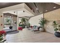 Elegant building lobby with neutral tones, comfortable seating, and tiled flooring at 1930 Harbourside Dr # 142, Longboat Key, FL 34228