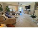 Comfortable living room featuring tile floors, neutral decor, and ample natural light at 452 N Jefferson Ave # 117, Sarasota, FL 34237