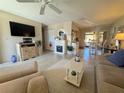 Spacious living area with an open floor plan, tile flooring, and stylish fireplace at 452 N Jefferson Ave # 117, Sarasota, FL 34237