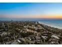 Expansive aerial view of the coastal community near a calm bay under a clear blue sky at 4646 Gleason Ave, Sarasota, FL 34242