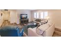 Comfortable living room with wood flooring, stylish furniture, and bright natural light at 700 Golden Beach Blvd # 222, Venice, FL 34285
