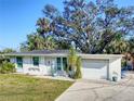Charming single-story home boasts a well-maintained lawn and attached one-car garage at 240 Pocono E Trl, Nokomis, FL 34275