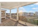Balcony view with sturdy railings and a stunning neighborhood scenery on a beautiful sunny day at 12413 Gulf Breeze Ter, Cortez, FL 34215