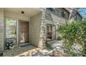Charming front entrance with decorative lattice at 1610 Treehouse Cir # T130, Sarasota, FL 34231