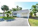 Well-maintained single-story home with covered parking, neat landscaping, and a welcoming facade at 2332 Canalbluff Pl # 298, Sarasota, FL 34231