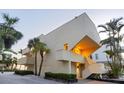 Exterior evening view of a unique beachfront home showcasing its architectural design at 540 Beach Rd # 510, Sarasota, FL 34242
