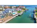 Waterfront property featuring a modern home, pool, boat dock, and canal access at 560 Schooner Ln, Longboat Key, FL 34228