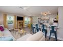 Bright living space with open floor plan, stylish seating, and modern finishes at 617 26Th W St, Bradenton, FL 34205