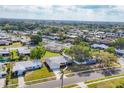 Expansive aerial shot showcases the home's location in a peaceful neighborhood with mature trees at 6637 Bowline Dr, Sarasota, FL 34231