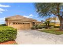 Attractive single-Gathering house with a two-car garage, surrounded by green shrubbery and a well-kept lawn at 12211 Aster Ave, Bradenton, FL 34212