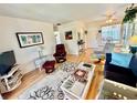 Comfortable living room with hardwood floors, open layout, and dining area at 1633 Leisure Dr # M-37, Bradenton, FL 34207