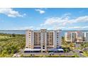 View of a multi-story residential building with water views and parking at 2625 Terra Ceia Bay Blvd # 206, Palmetto, FL 34221