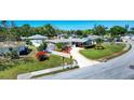 Charming single-story home featuring well-manicured lawn, mature landscaping, and a convenient driveway for easy parking at 4008 Cape Vista Dr, Bradenton, FL 34209