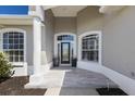 Inviting front entrance with decorative windows and a stylish front door at 4606 Lake Fox Pl, Parrish, FL 34219