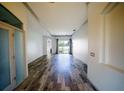 Hallway leading to the bright and spacious living areas of the home at 4706 Cayo Costa Pl, Bradenton, FL 34203