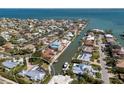 Expansive aerial view of a waterfront home in a canal community with easy access to the ocean at 500 Halyard Ln, Longboat Key, FL 34228