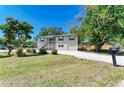 Charming two-story home with a front yard featuring white gravel and a convenient attached garage at 5311 San Jose Dr, Sarasota, FL 34235