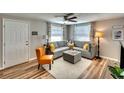 Inviting living room featuring neutral decor, comfortable seating, and a ceiling fan for added comfort at 6434 5Th W St, Bradenton, FL 34207