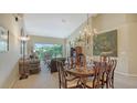 Spacious living room boasts high ceilings, ample natural light, and stylish decor at 7609 Sweetbay Cir # 7609, Bradenton, FL 34203