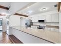 Well-lit kitchen boasting a large island, stainless steel appliances, and white cabinetry at 8036 Conservatory Cir, Sarasota, FL 34243