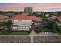 Gorgeous waterfront estate featuring a private pool, lanai and dock access to the harbor at 805 3Rd E St, Palmetto, FL 34221