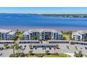 Charming waterfront condos with covered parking, palm trees, and water views at 920 Tidewater Shores Loop # 304, Bradenton, FL 34208