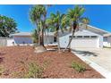 Inviting single-story home with lush landscaping and a two-car garage, radiating curb appeal at 1112 67Th Nw St, Bradenton, FL 34209
