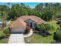 Picturesque aerial view of a well-maintained house showcasing its roof and landscaping at 11419 Pine Lilly Pl, Lakewood Ranch, FL 34202