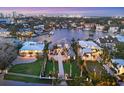 An aerial view shows the neighborhood, waterfront location, and manicured landscaping of this luxury residence at 1333 Vista Dr, Sarasota, FL 34239