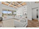 Bright living room features a wood-paneled ceiling, large sectional sofa, and expansive outdoor views at 16768 San Edmundo Rd, Punta Gorda, FL 33955