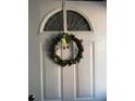 Charming front door adorned with a festive St. Patrick's Day wreath at 2330 Canal Dr # G27, Bradenton, FL 34207