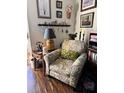 Cozy living room featuring a comfortable armchair, complemented by charming decor and a serene atmosphere at 2330 Canal Dr # G27, Bradenton, FL 34207