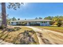 Beautiful single-story home with attractive landscaping and shutters, enhancing its curb appeal at 3124 Tanglewood Dr, Sarasota, FL 34239