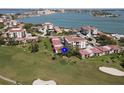 Stunning aerial view of the property on the golf course with beautiful water views and lush landscaping at 6269 Palma Del Mar S Blvd # 308, St Petersburg, FL 33715
